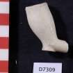 Clay pipe bowl and short part of stem, D7309. Scale in centimetres.