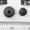 Two wooden beads (D8063, 8062). Scale in inches.