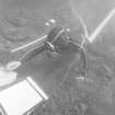 Archaeologist Colin Martin excavating with a water-dredge. Note the drawing-board and finds box. (Jeremy Green)