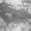 Oak lodging-knee detached from the collapsed upper structure, lying beneath the aftermost surviving end of the keel (upper left to centre) and the long wale (right). Scale 1 foot.