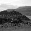 General view of the dun at Kraiknish, taken from the SE. The figure in the foreground is probably RCAHMS archaeologist J Graham Callander.