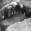 Group of 4 gentlemen about to remove the lid of a cist at Mount Vernon, Greenoakhill. Ludovic Mann is second from the right.