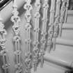 Interior.  Detail of decorative staircase railings.