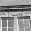 Detail of stone decoration above window.