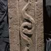Strathmartine no 2 recumbent graveslab. View showing two serpents and spiral border decoration
