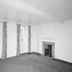 Interior. Ground floor View of bedroom 1 in E wing from NE showing 18th century fireplace and panelling