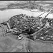 Aerial view showing town, walls and river.