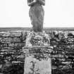 Photograph of sculpture by John Nicolson of woman on pedestal, with names and dates of family, possible in Canisbay Churchyard