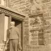 Scanned image of photograph of John Nicolson outside his home, Summerbank House, Auckengill
