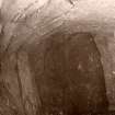 Scanned image of a photographic copy of a photograph, possibly of the interior of a stone-built chamber.