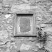 View of cross mounted on wall of Corrimony House. The cross is said to be from the former chapel of the Knights Templar (NH53SW2) and has since been moved to St Ninian's Church.