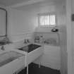 Interior. Basement utility room with belfast sinks