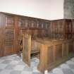 Interior. View of 1903 choir stalls and 17th century panelling