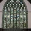 Interior. View of E window medieval tracery with stained glass by C E Kempe