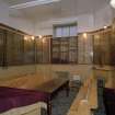 Interior. 'Mini' Synagogue in W corner showing memorial walls