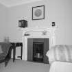 Interior. Detail of fireplace in rear bedroom in Victorian wing