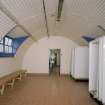 Interior view of officers ablutions (hut 22) showing shower cubicles