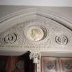 Interior. W lobby, detail of tympanum with portrait  medallion of Rev John Eadie by John Mossman 1876