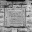 Detail of P Macgregor-Chalmers plaque inscribed "ST LEONARDS CHURCH HALL BUILT AD 1910"