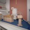 Interior. Ground floor. Pulpit, font and communion table.