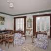 Interior. First floor. Drawing room showing the windows (dining table and chairs not originally in the room)