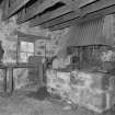 Smithy. Interior. Detail of hearth and bellows