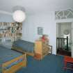 Interior. Fourth floor. Front bedroom showing panelling and fanlight