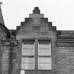 Detail of finialled crowstepped dormer gable with initials