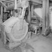 Interior. first floor of mill, view from NE of 'Caledonia Mill', with surviving pair of conventional millstones just visible to right