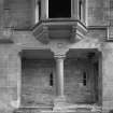 Detail of loggia with granite column and billiard room oriel window above