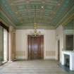 Interior. Ante drawing room from W showing shallow vault, doors to dining room and original chandelier