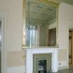 Interior. Ante drawing room Detail of white marble fireplace and overmantle mirror.