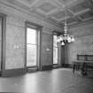 Interior. Dining room View from SW showing windows and  curtain poles