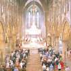 Interior.
View from gallery of nave, crossing area with choir and apse ended chancel during Pentecost Sunday service.