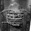 Interior. Detail of fireplace in entrance hall showing register grate with toasting armature