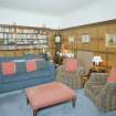 Interior. View of ground floor TV room original dining room from NE showing bookcases