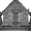 Detail of ornamental window pediment with architects' initials "PK" and "1860" on apron on No. 15