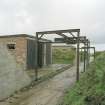 View from W looking along bomb store sheds and bomb loading gantry.