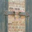 Detail of bomb store shed showing coupled hinges for doors.