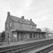 View from N of station offices and house, situated on the S-bound platform on the SE side of the station