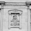 Detail of 1869 date plaque with cipher and crest