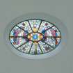 Interior. Detail of E wall oval stained glass window