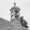 Birdcage bellcote, with clock and 1804 datestone