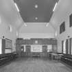 Interior.
View of church hall from W showing gallery.