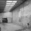 Interior.  View from SW in lean-to area at the NE side of the warehouse building ('Room 4')