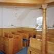 Interior.
Detail of pews and gallery column.