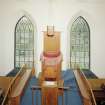 Interior.
View from N at gallery level showing pulpit.