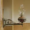 Interior. 
Detail of oil lamp and bracket.