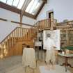 Interior, view of studio from West Interior, showing bookcases, entrance staircase and manequin representing Hornel at work