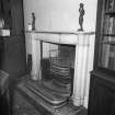 Interior, detail of first floor drawing room white marble fireplace c.1820 with register grate